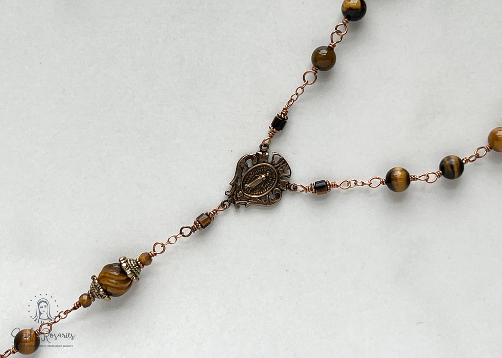 handmade, heirloom-quality, unbreakable tiger eye rosary, carved pater beads, solid bronze construction, centerpiece and crucifix, brown and black beads
