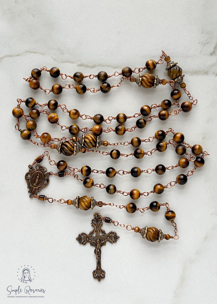 handmade, heirloom-quality, unbreakable tiger eye rosary, carved pater beads, solid bronze construction, centerpiece and crucifix, brown and black beads