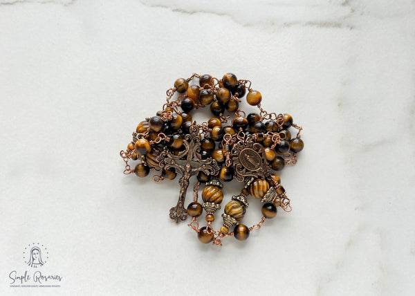 handmade, heirloom-quality, unbreakable tiger eye rosary, carved pater beads, solid bronze construction, centerpiece and crucifix, brown and black beads
