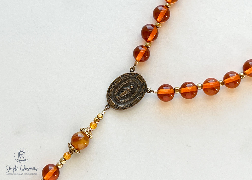 handmade heirloom quality baltic amber and bronze rosary strung on durable soft flex wire, orange and gold
