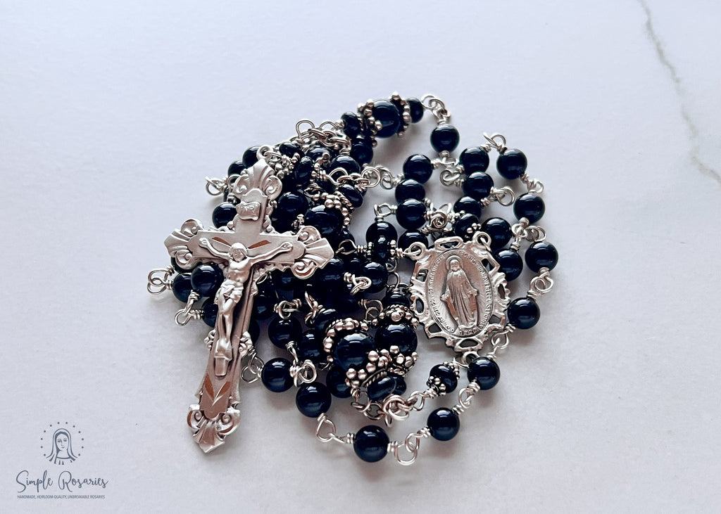 Handmade, heirloom-quality rosary featuring unbreakable onyx beads and durable solid sterling silver construction, designed for lasting beauty and spiritual significance