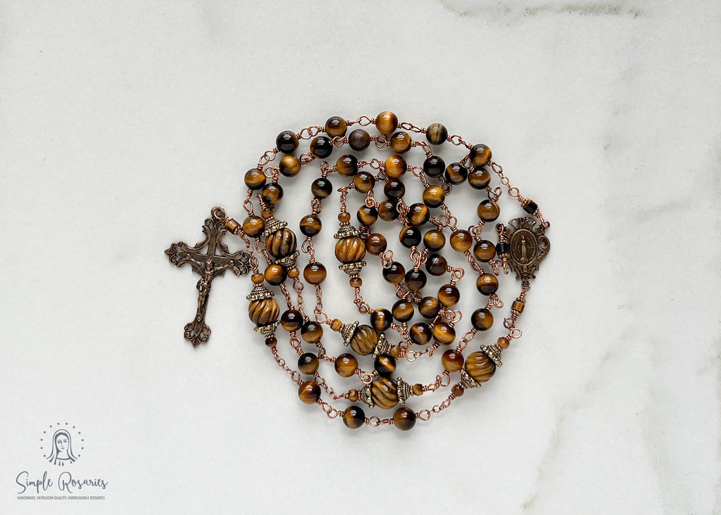 handmade, heirloom-quality, unbreakable tiger eye rosary, carved pater beads, solid bronze construction, centerpiece and crucifix, brown and black beads