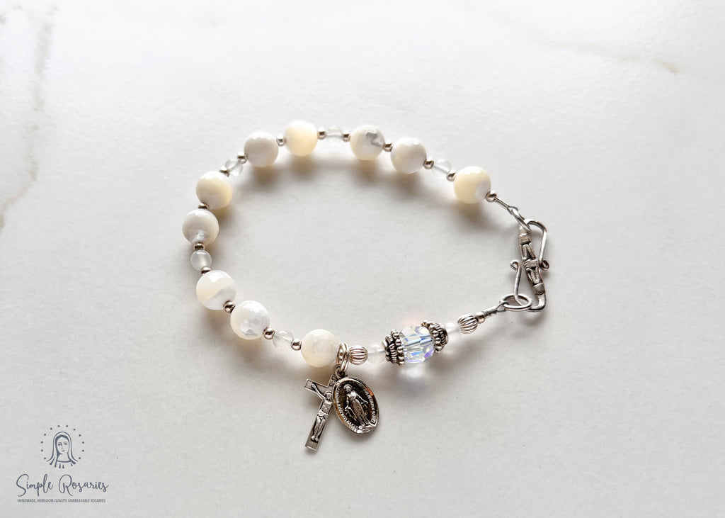 handmade, heirloom quality rosary bracelet with mother of pearl and Swarovski crystal, solid sterling silver accents, crucifix and miraculous medal