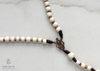 handmade, heirloom-quality, unbreakable rosaries, solid bronze centerpiece and crucifix, seed beads, white wood and cord rosary